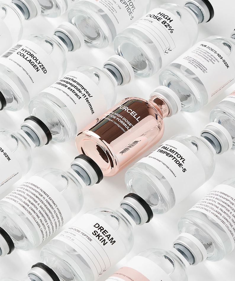 PURCELL 82% High Dose™ Peptide Formula 30mL, flacons blancs et cuivrés de la marque PURCELL, image studio.
