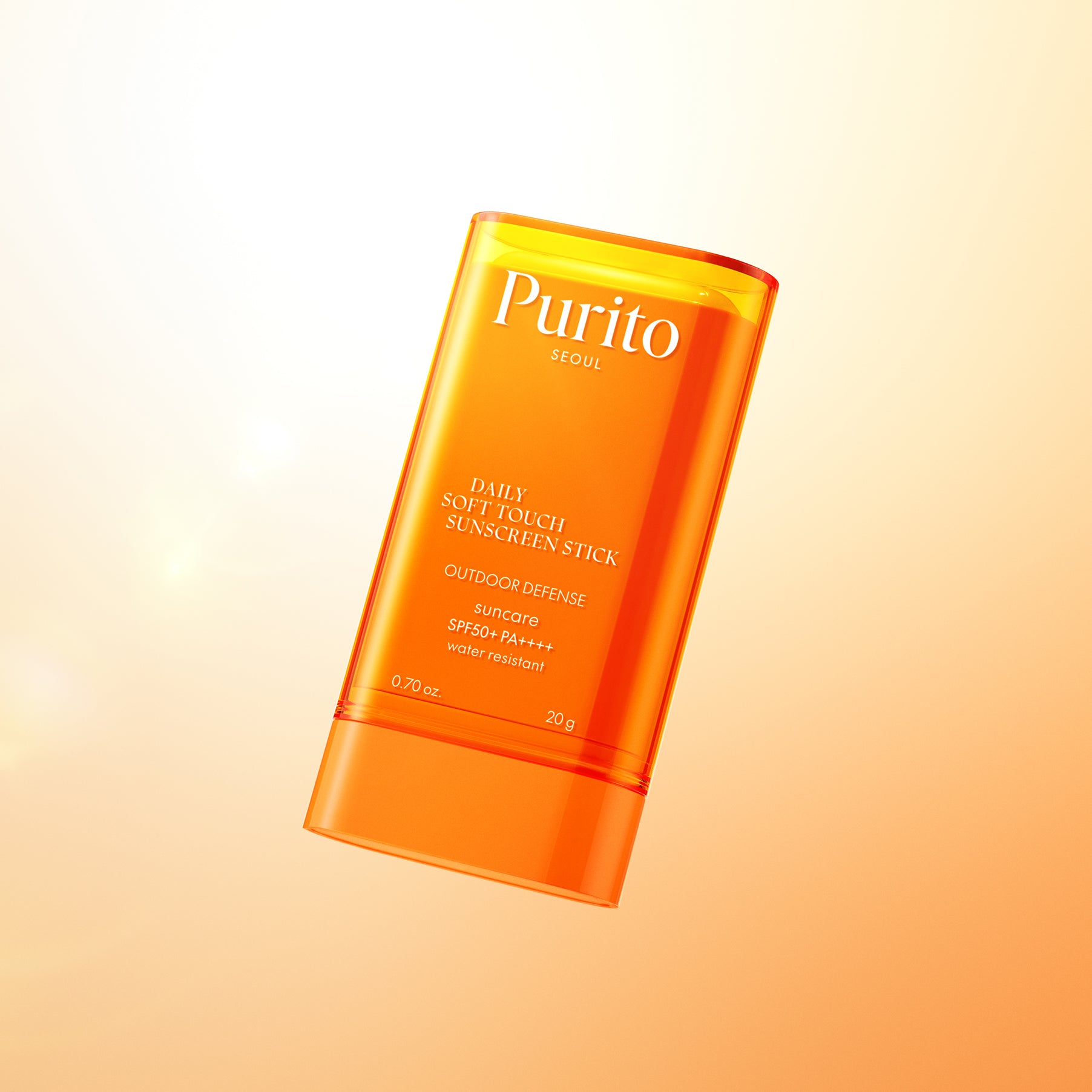 PURITO Daily Soft Touch Sun Stick SPF50+PA++++ de Purito en stick orange sur fond beige, style skincare ensoleillé.