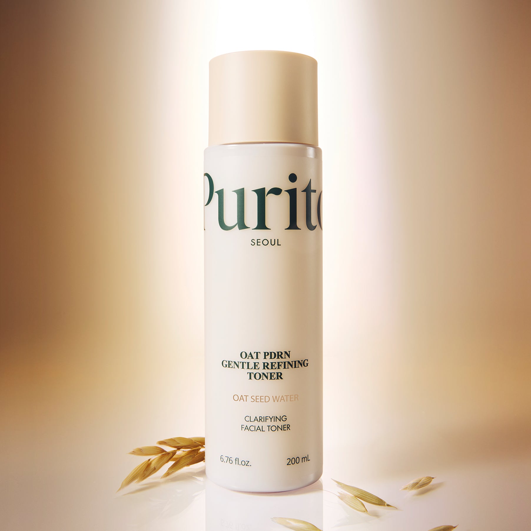 PURITO Oat PDRN Gentle Refining Toner 200ml, bouteille PURITO Seoul sur fond beige avec grains d’avoine