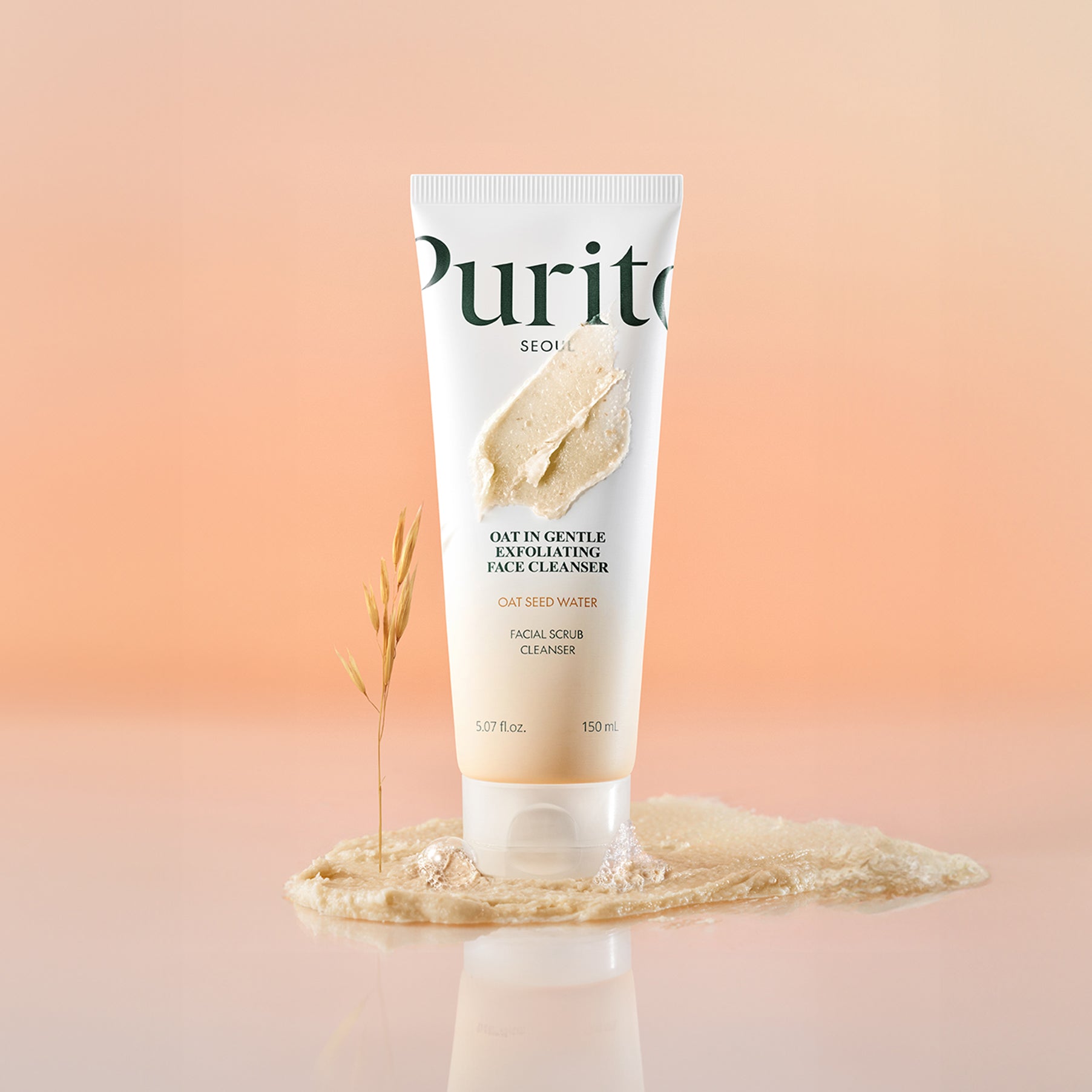Décris l'image en français en mentionnant PURITO Oat in Gentle Exfoliating Face Cleanser, la marque Purito, tube sur fond beige.
