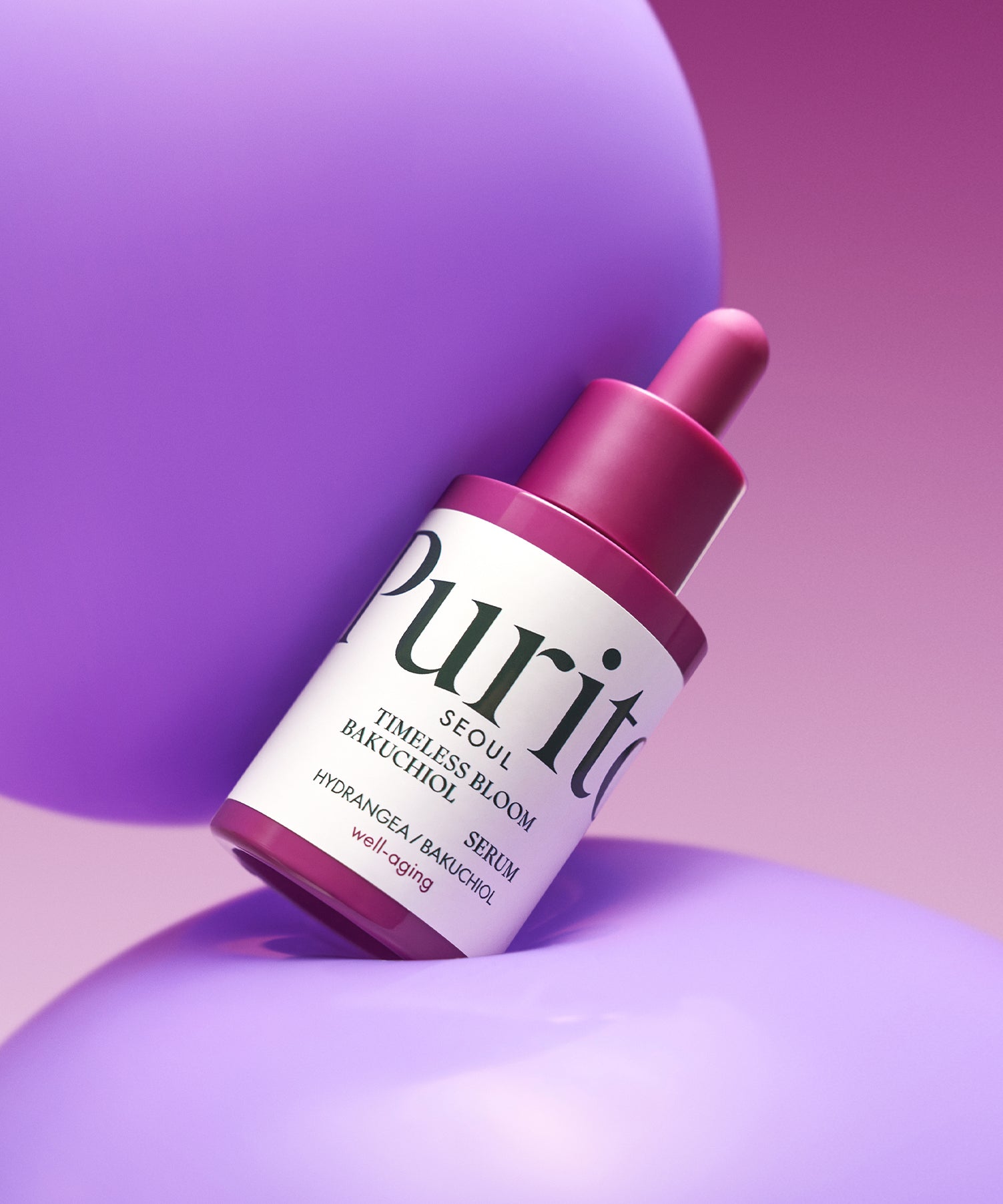 PURITO Timeless Bloom Bakuchiol Serum 30ml de la marque Purito, flacon violet sur fond rose, esthétique cosmétique.