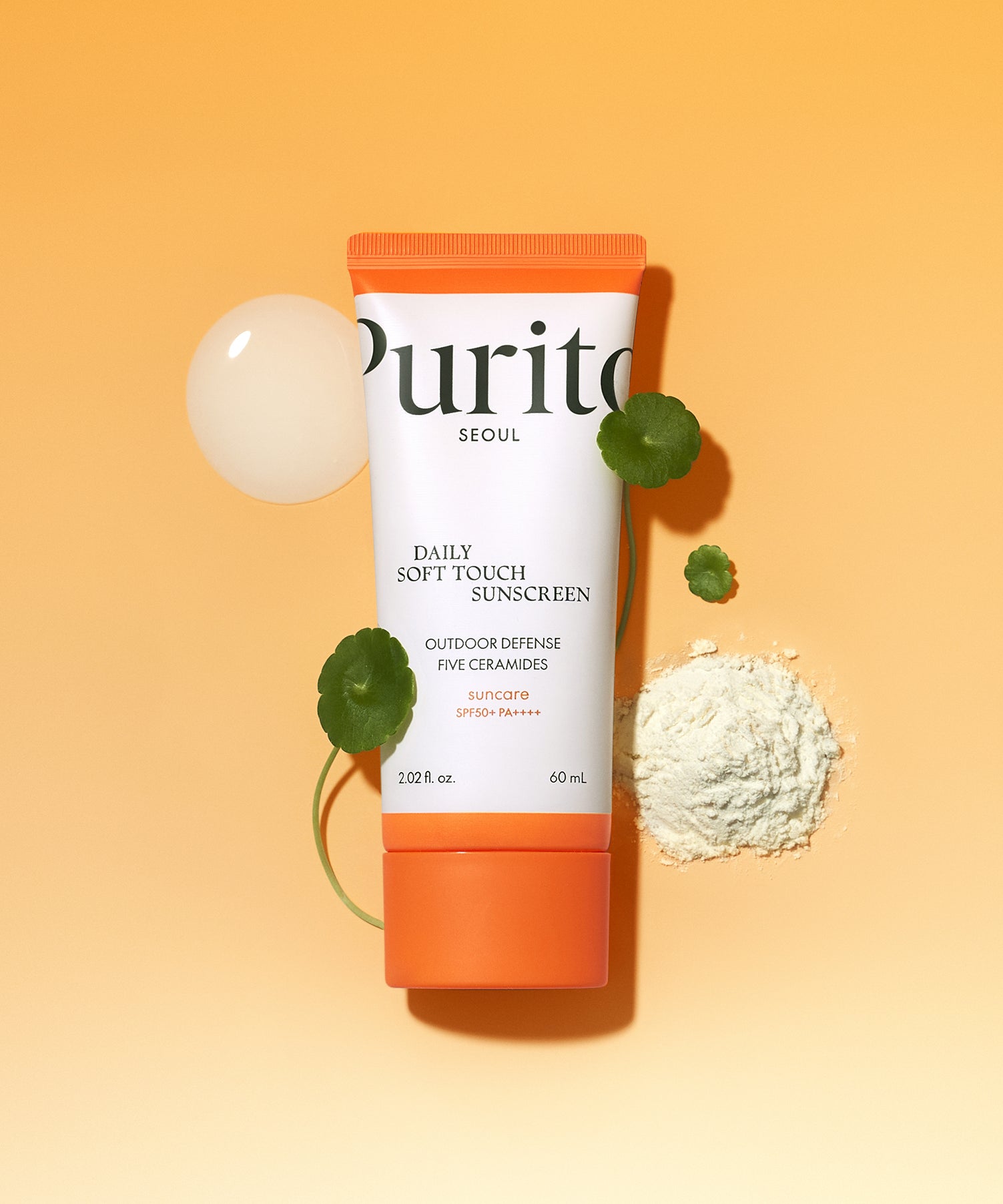 Crème solaire PURITO Daily Soft Touch Sun Cream SPF50+PA++++ sur fond orange, tube de 60 ml.