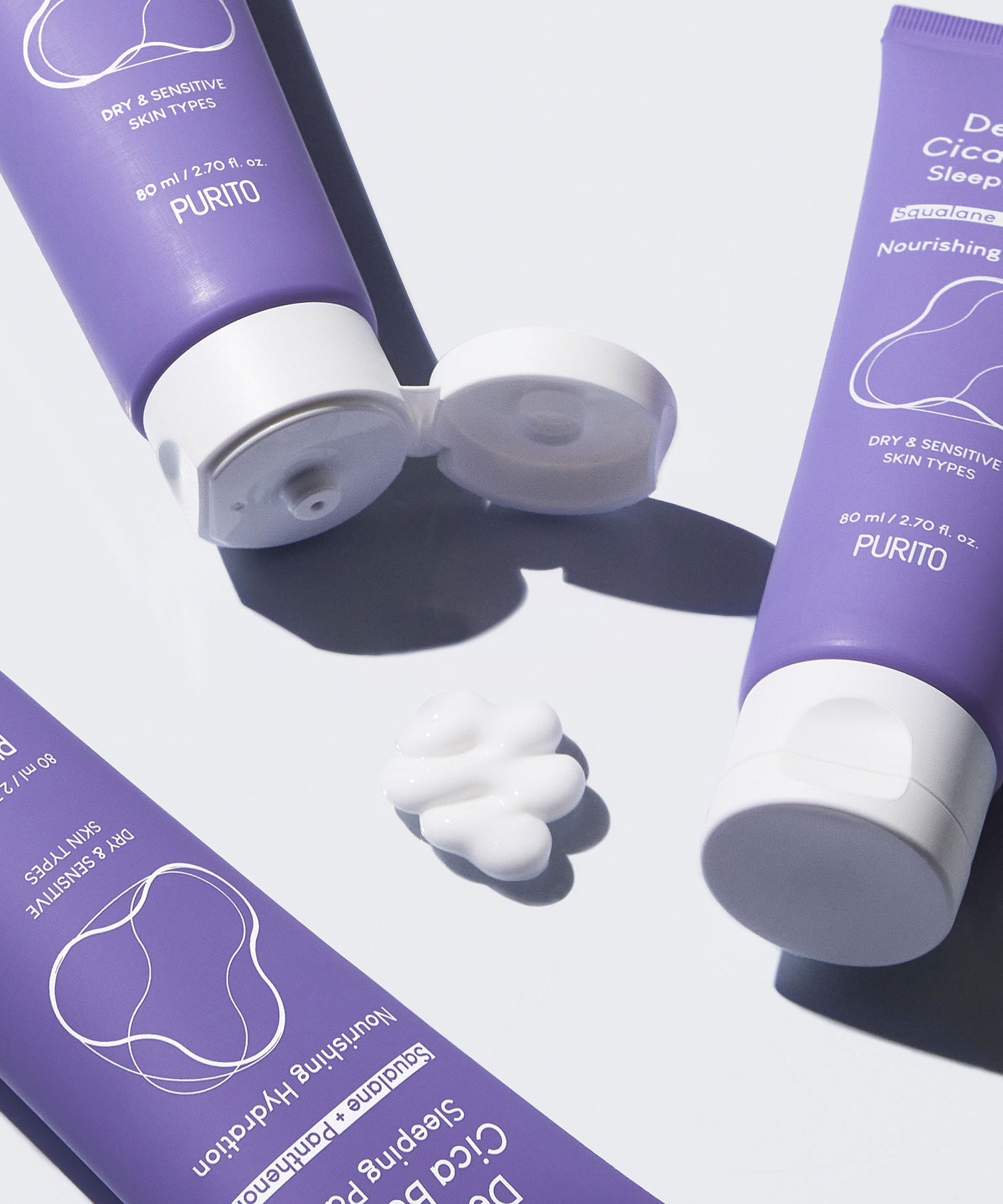 Trois tubes de PURITO Dermaid Cica Barrier Sleeping Pack 80ml avec crème blanche, soin pour peaux sensibles et sèches.