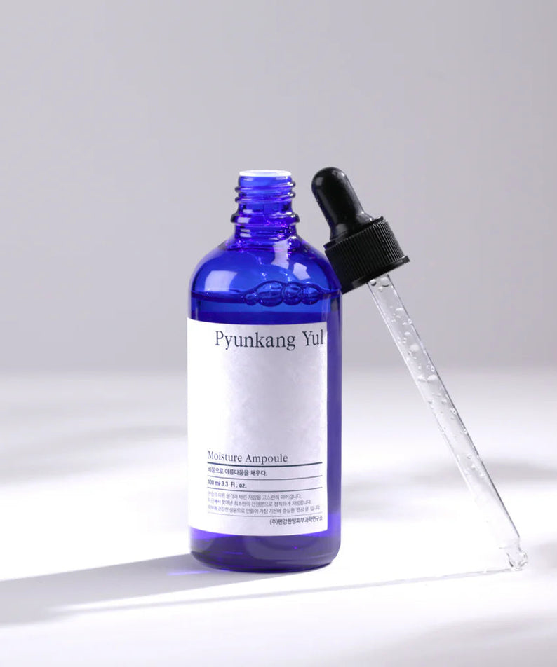 Flacon de PYUNKANG YUL Moisture Ampoule 100ml avec pipette, soin hydratant efficace.