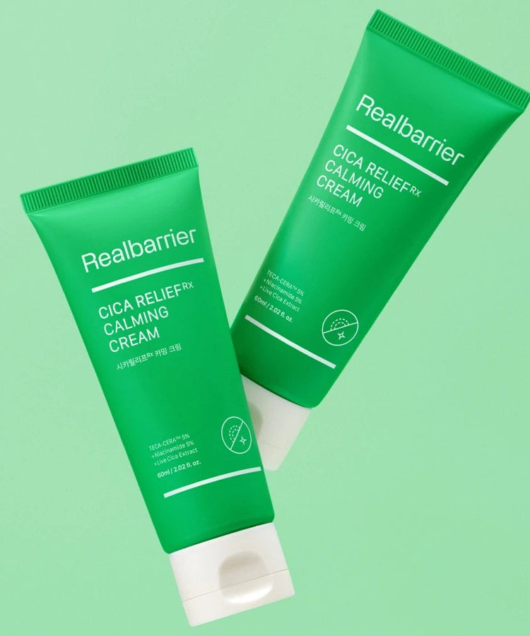 Décris l'image en français en mentionnant le produit, la marque et le contexte visuel : REAL BARRIER Cica Relief Rx Calming Cream 60ml, tubes vert sur fond vert.