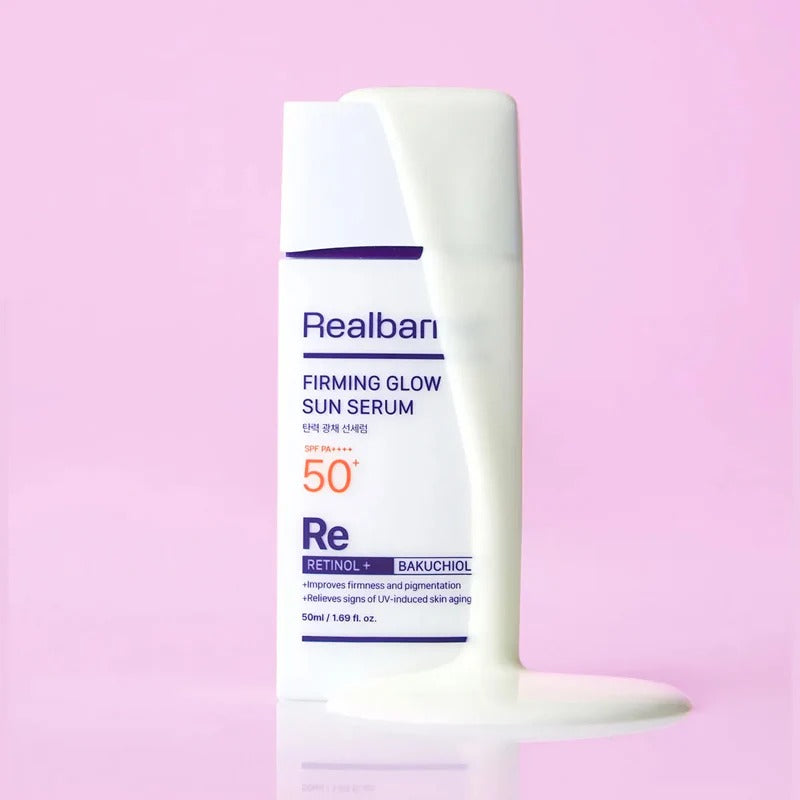 REAL BARRIER Elasticity & Radiance Sun Serum 50ml, flacon crème sur fond rose, marque Realbarri, contexte cosmétique