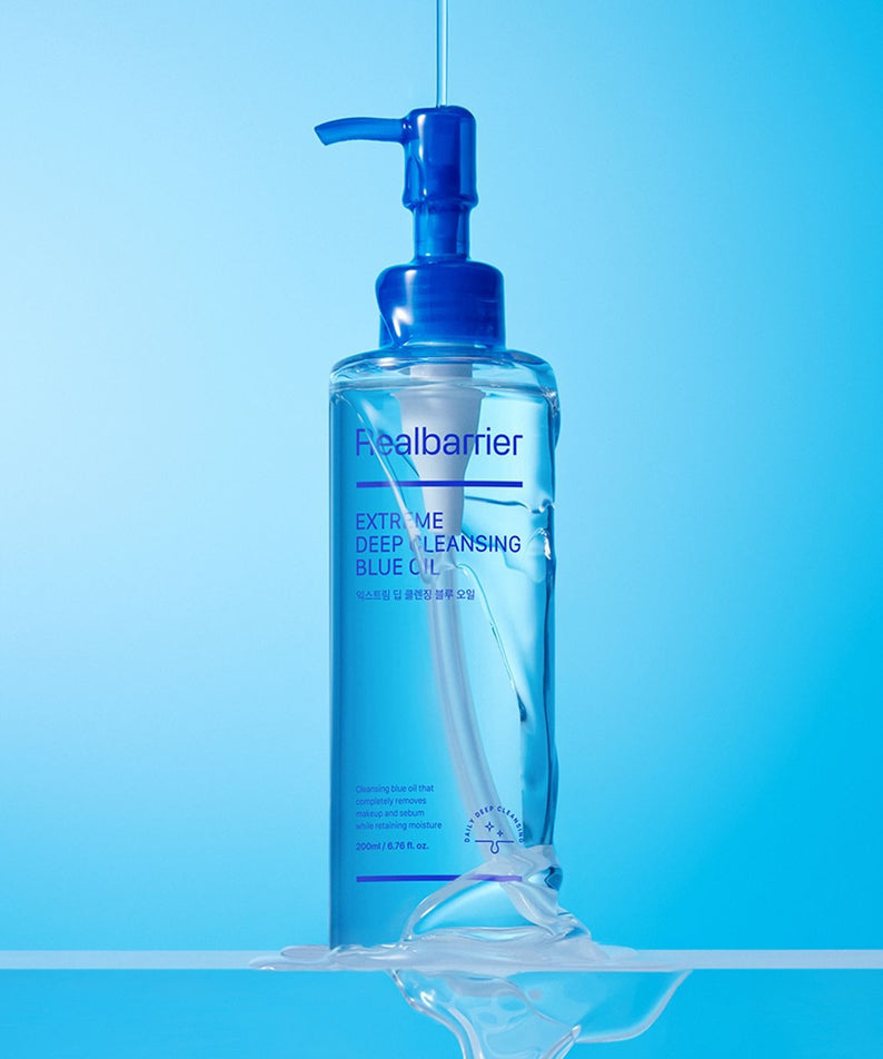 REAL BARRIER Extreme Deep Cleansing Blue Oil 200ml, flacon bleu sur fond clair bleu, marque Real Barrier en contexte visuel.