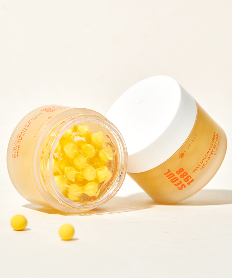 SEOUL 1988  Niacin Yuja Capsule Cream 50ml : crème en capsule ouverte, marque sur le flacon, fond clair.