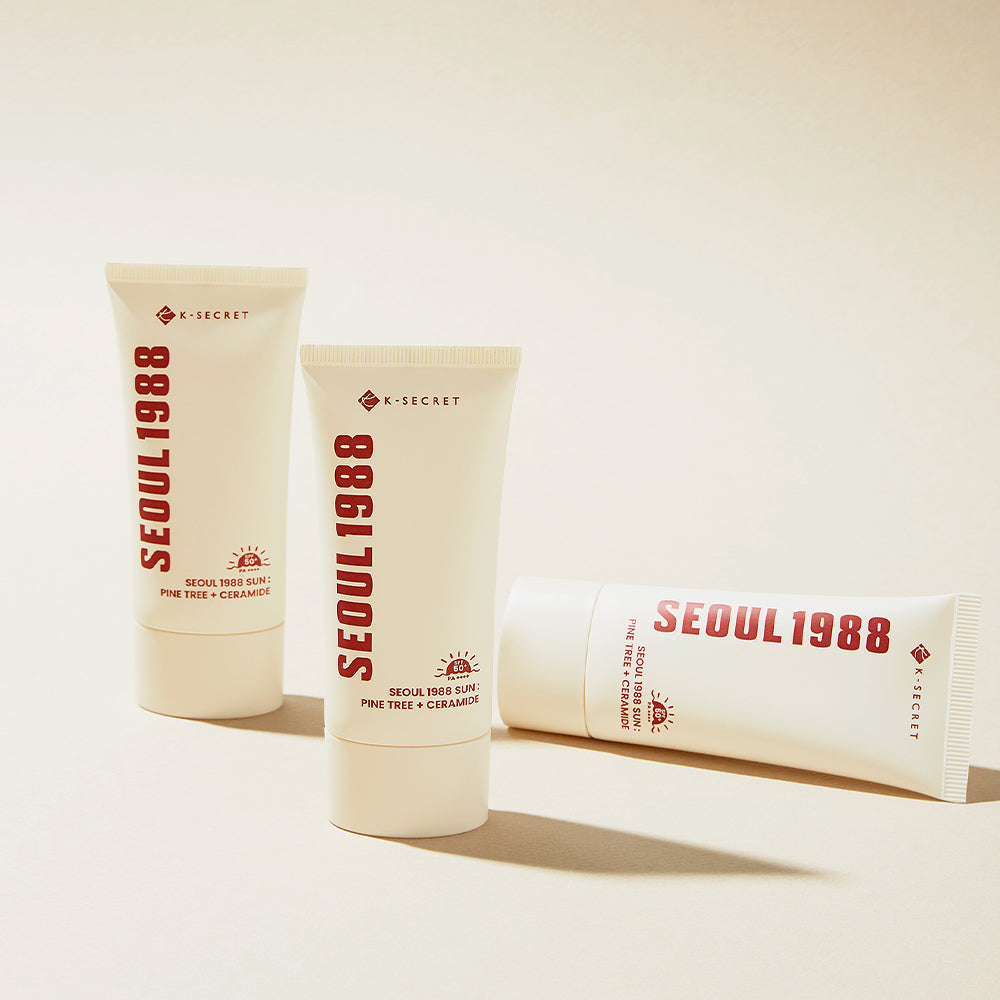 SEOUL 1988 Pine Sunscreen 50ml, marque X-Secret, tubes crème solaire posés sur fond clair en studio