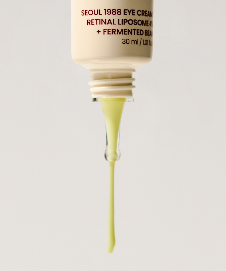 Décris l'image en français : SEOUL 1988 Retinal Fermented Soybean Eye Cream 30ml, crème contour des yeux, tube pressé sur fond clair.