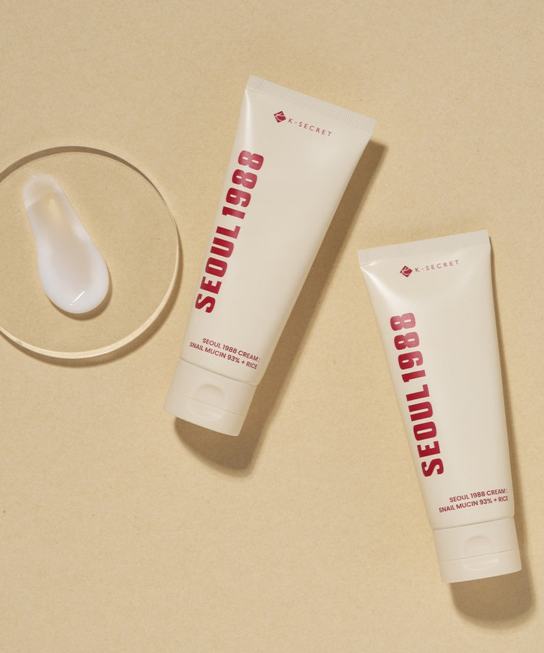 SEOUL 1988 Snail 93 Cream 100ml, tube de crème de la marque A-SECRET sur fond beige, visuel produit cosmétique.