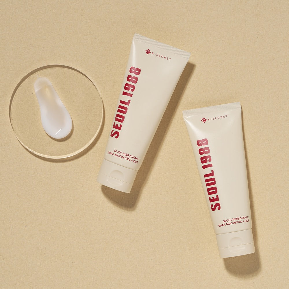 SEOUL 1988 Snail 93 Cream 100ml, tube de crème de la marque A-SECRET sur fond beige, visuel produit cosmétique.