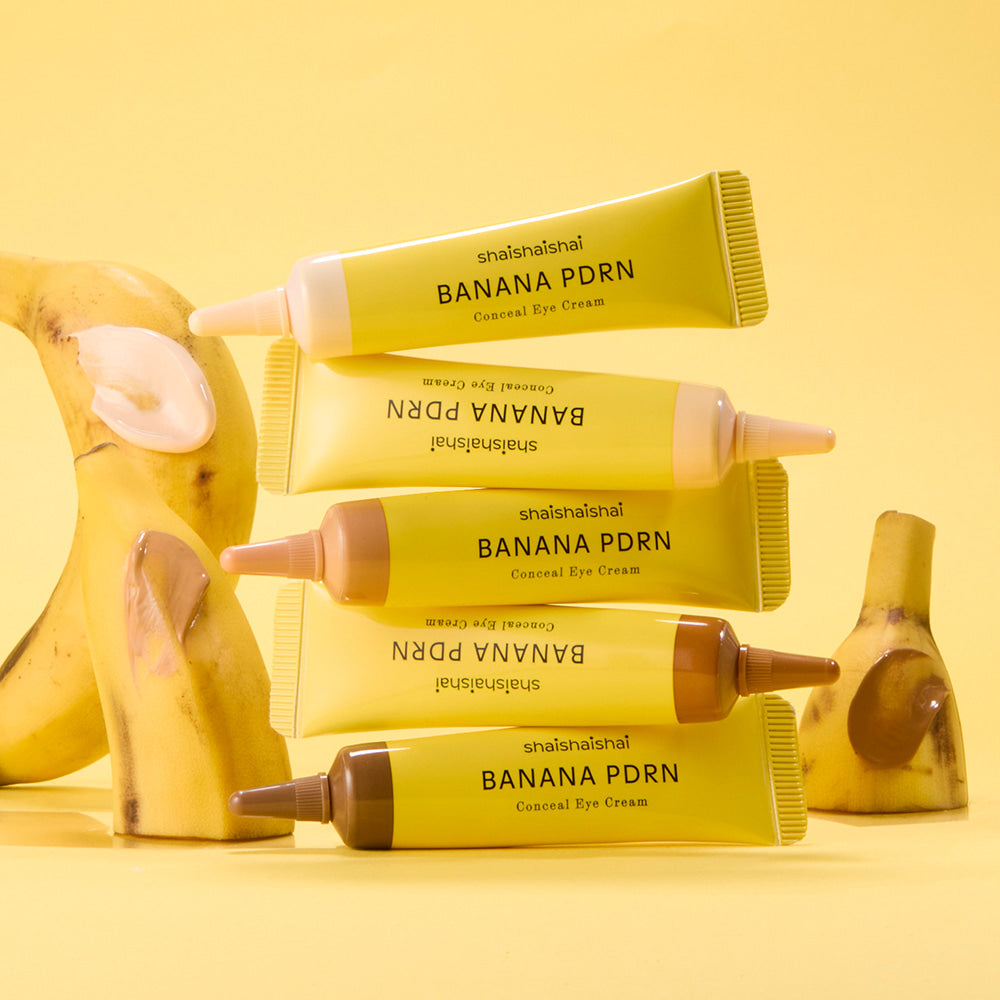 SHAISHAISHAI Banana PDRN Conceal Eye Cream 15ml, tubes sur fond jaune, ambiance beauté avec bananes
