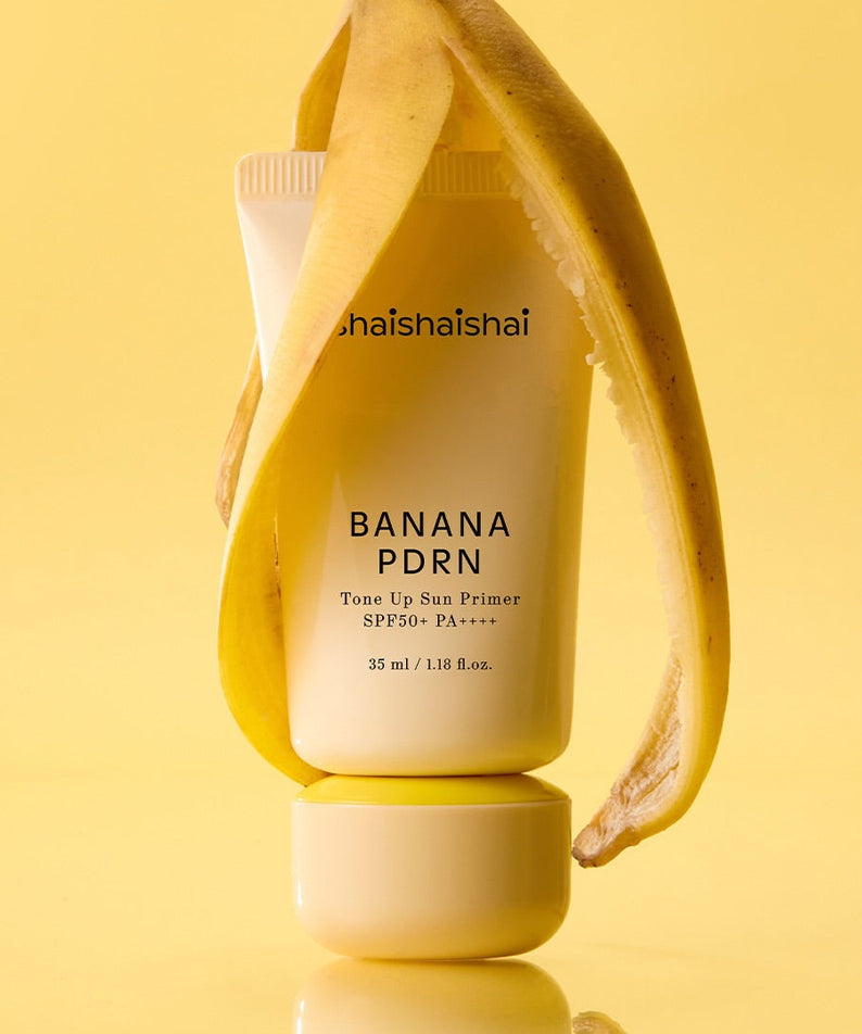 SHAISHAISHAI Banana PDRN Tone-Up Sun Primer 35ml, photo produit sur fond jaune ensoleillé, style cosmétique.