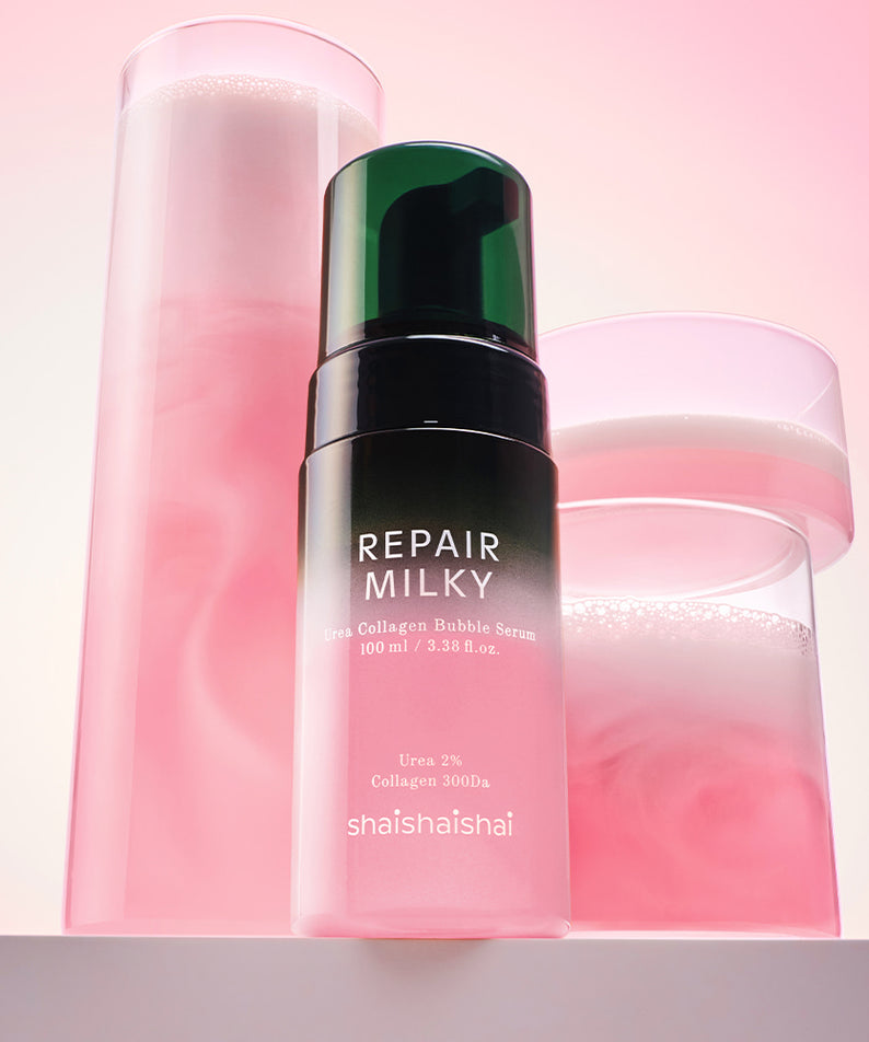 SHAISHAISHAI Repair Milky Urea Glow Bubble Serum 100ml : flacon rose sur fond pastel, contexte cosmétique visuel.