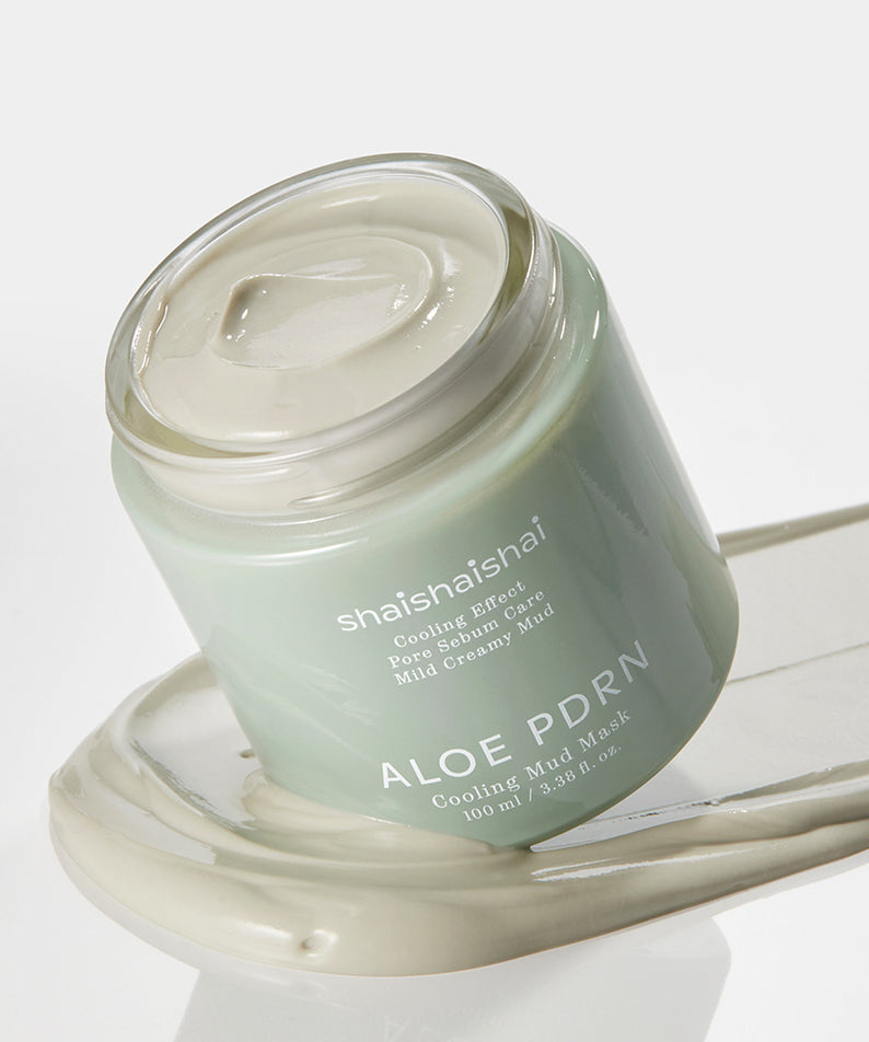 Pot de SHAISHAISHAI [1+1]Aloe PDRN Cooling Mud Mask 100ml montrant le masque vert sur une surface blanche.