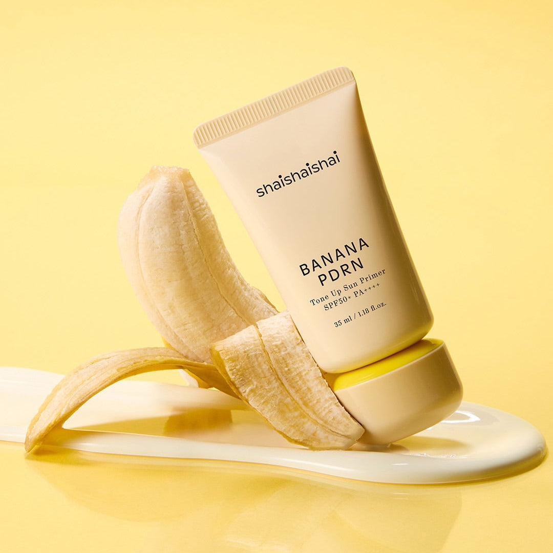 SHAISHAISHAI Banana PDRN Tone-Up Sun Primer 35ml sur fond jaune, avec bananes en contexte beauté.