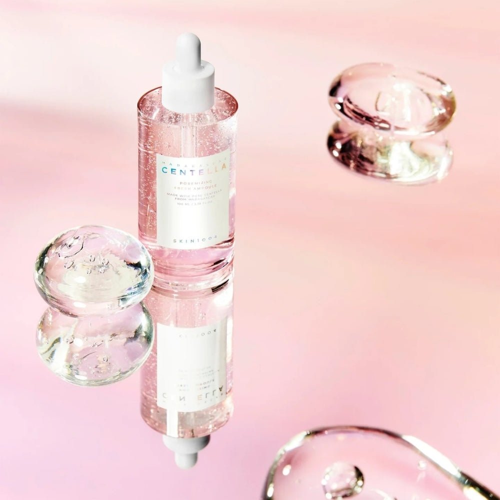 SKIN1004 Madagascar Centella Poremizing Fresh Ampoule 100ml, marque SKIN1004, flacon ampoule sur fond rose, contexte beauté
