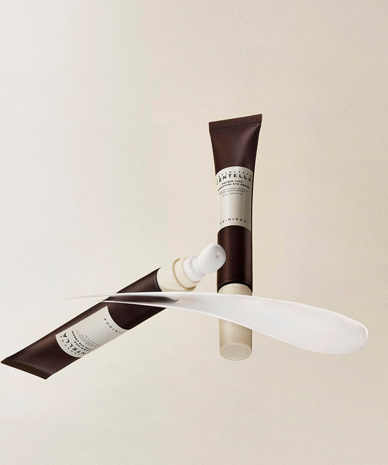 SKIN1004 Madagascar Centella Probio-cica Bakuchiol Eye Cream 20ml : tube et applicateur, décor minimal blanc, crème contour yeux