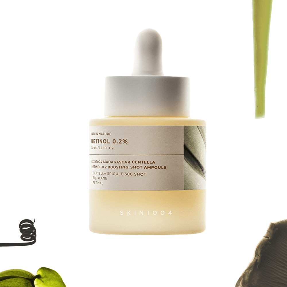 SKIN1004 Madagascar Centella Retinol 0.2 Boosting Shot Ampoule 30ml, sérum avec goutte verte et flacon sur fond clair