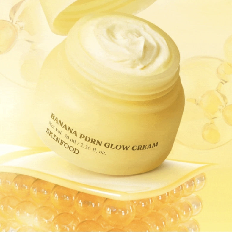 SKINFOOD Banana PDRN Glow Cream 70ml de marque SKINFOOD, crème lumineuse sur fond jaune avec texture banane
