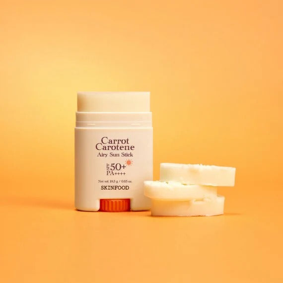 SKINFOOD Carrot Airy Soft Sun Stick 18.5g, stick solaire marque SKINFOOD sur fond orange, produit en photo