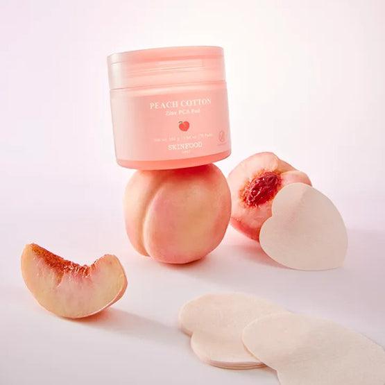 SKINFOOD [NEW] Peachy Zinc PCA Pad 70 sheets sur fond clair, pads et pot rose pêche, contexte beauté.