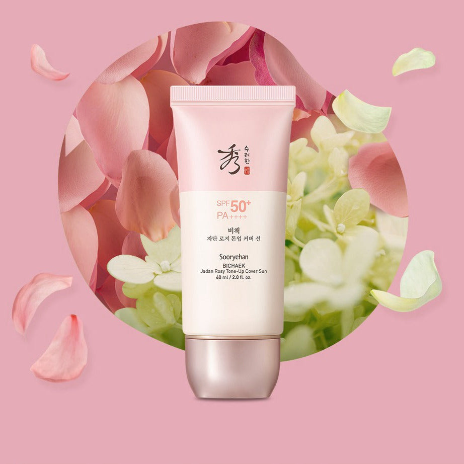 SOORYEHAN Bichaekjadan Rosy Tone-up Cover Sun 60ml, tube crème SPF50 sur fond rose avec pétales et fleurs, marque SOORYEHAN