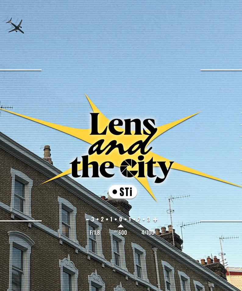 STI - [Lens and the City] - Album Kpop : pochette avec skyline, immeubles urbains et avion, ciel bleu, marque STI visible