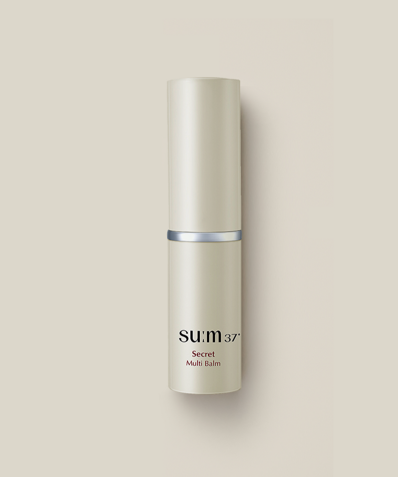Produit cosmétique SU:M37 Secret Multi Balm 7g, baume multi-usage pour la peau, soins beauté haut de gamme en flacon beige.