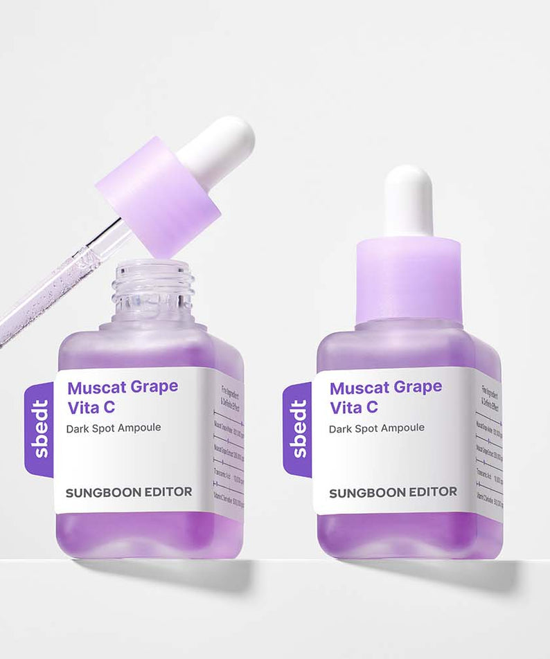 Décris l'image en français : SUNGBOON EDITOR Grape Vita C Dark Spot Whitening Ampoule 40ml, deux flacons violets sur fond clair.