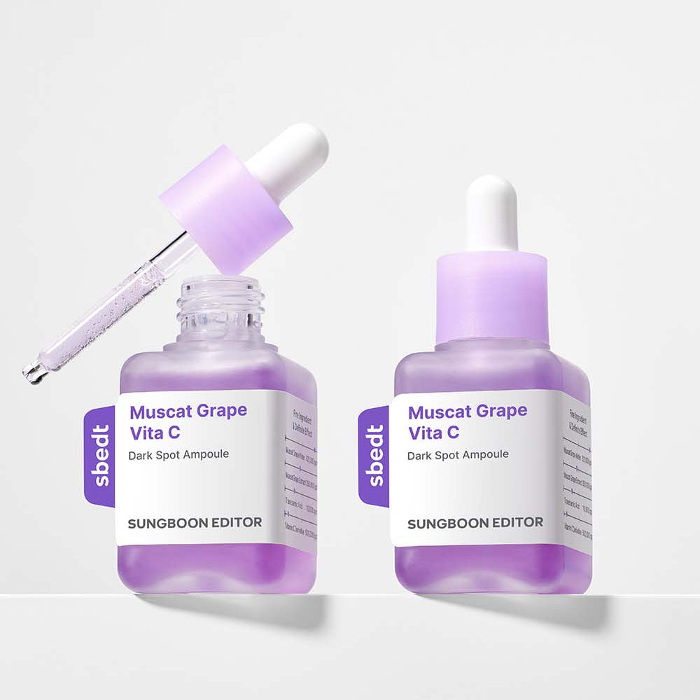 Décris l'image en français : SUNGBOON EDITOR Grape Vita C Dark Spot Whitening Ampoule 40ml, deux flacons violets sur fond clair.