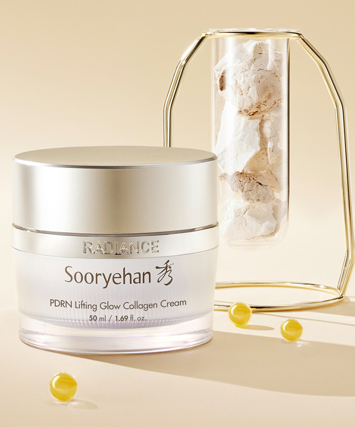 Crème SOORYEHAN Radiance PDRN lasticity 50ml exposée avec perles dorées et un récipient élégant.