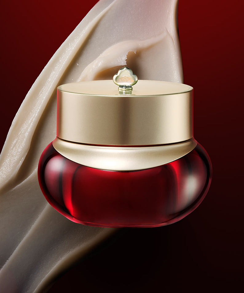 Crème anti-rides THE WHOO Jin Yul Hyang Anti-Wrinkle Enriching Cream 50ml, pot rouge et or sur fond texturé beige et rouge.