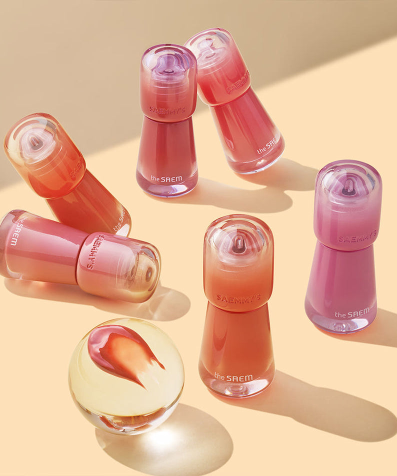 Collection de teintes THE SAEM Saemmy's Aid Shot Tint sur fond beige, mettant en valeur les nuances vibrantes.