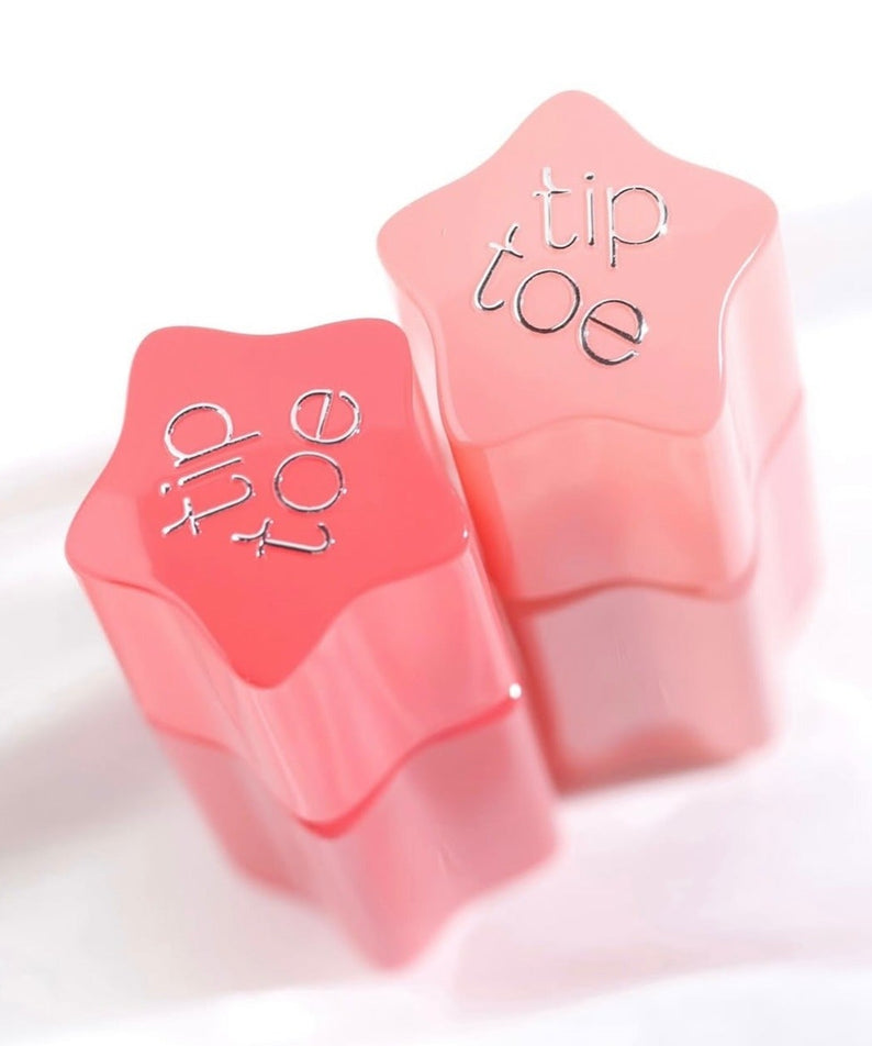 Deux tubes de TIP TOE Glowit Sorbet Tint en forme d'étoile rose, maquillage pour lèvres lumineux et tendance.