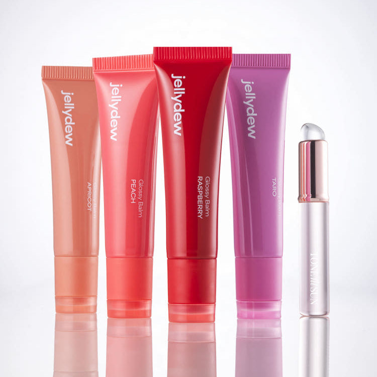 TONE FIT SUN Jelly Dew Glossy Balm 10g, baume brillant Tone Fit Sun d’eliV... en tubes sur fond blanc, contexte visuel maquillage.