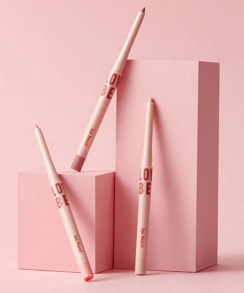 TONY MOLY Aegyo Beam Drawing Pencil de la marque TONY MOLY, stylos maquillage sur fond rose, packaging graphique.
