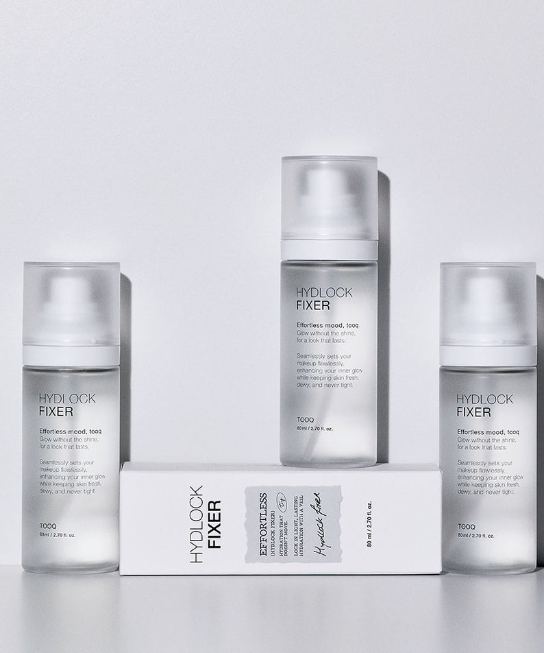 TOOQ Hydrock Fixer 80ml de la marque TOOQ, flacons et boîte sur fond clair, studio beauté, présentation produit.