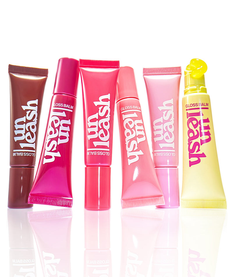 Collection de baumes à lèvres UNLEASHIA Sunset Dazzle Gloss Balm en différents coloris vifs sur fond blanc.