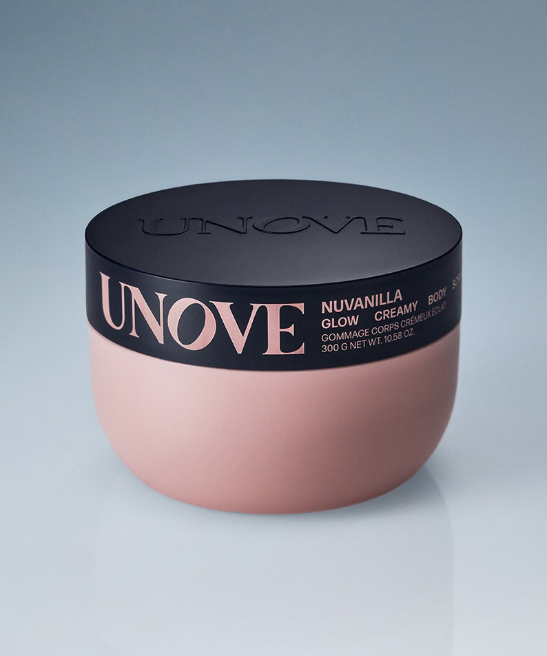 Boîte de UNOVE Anove Glow Creamy Body Scrub 300g avec couvercle noir et design élégant sur fond clair.