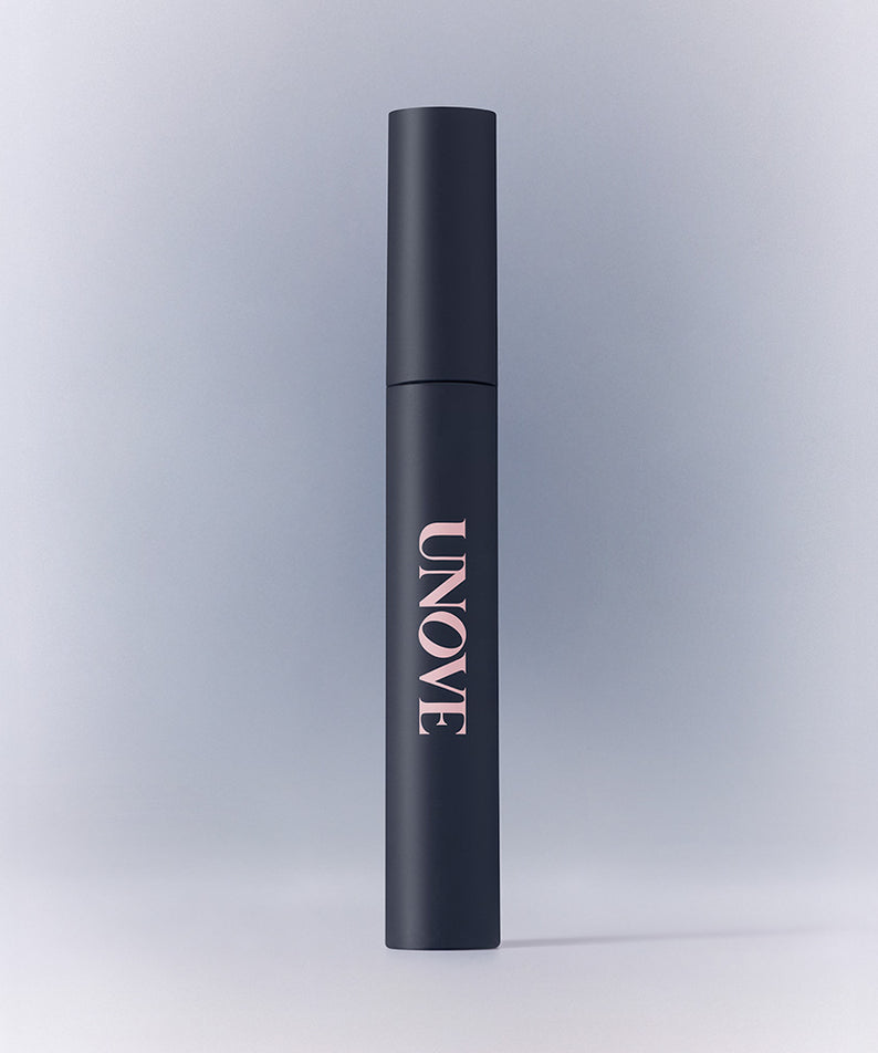 Bâton de finition capillaire UNOVE Frizz Calming Slick 10ml, anti-frisottis efficace pour cheveux lisses et soyeux.