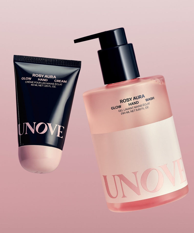 UNOVE Glow Hand Wash 290ml et crème mains sur fond rose, produits soin des mains élégants.