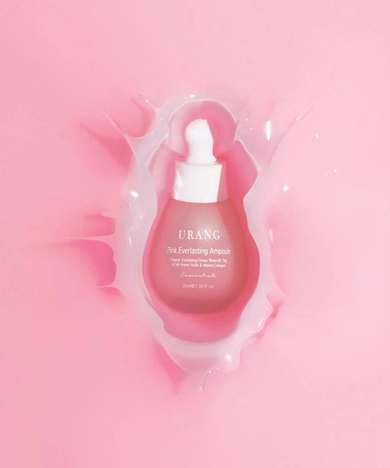 Flacon de l'URANG Pink Everlasting Ampoule sur fond rose, soin visage hydratant et nourrissant.