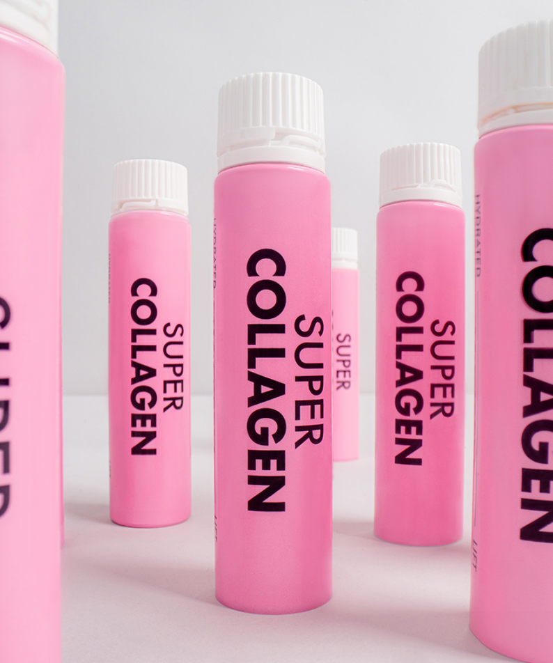 VITAL BEAUTIE Super Collagen 28 Tablets, bouteilles roses alignées sur fond blanc, branding visible.
