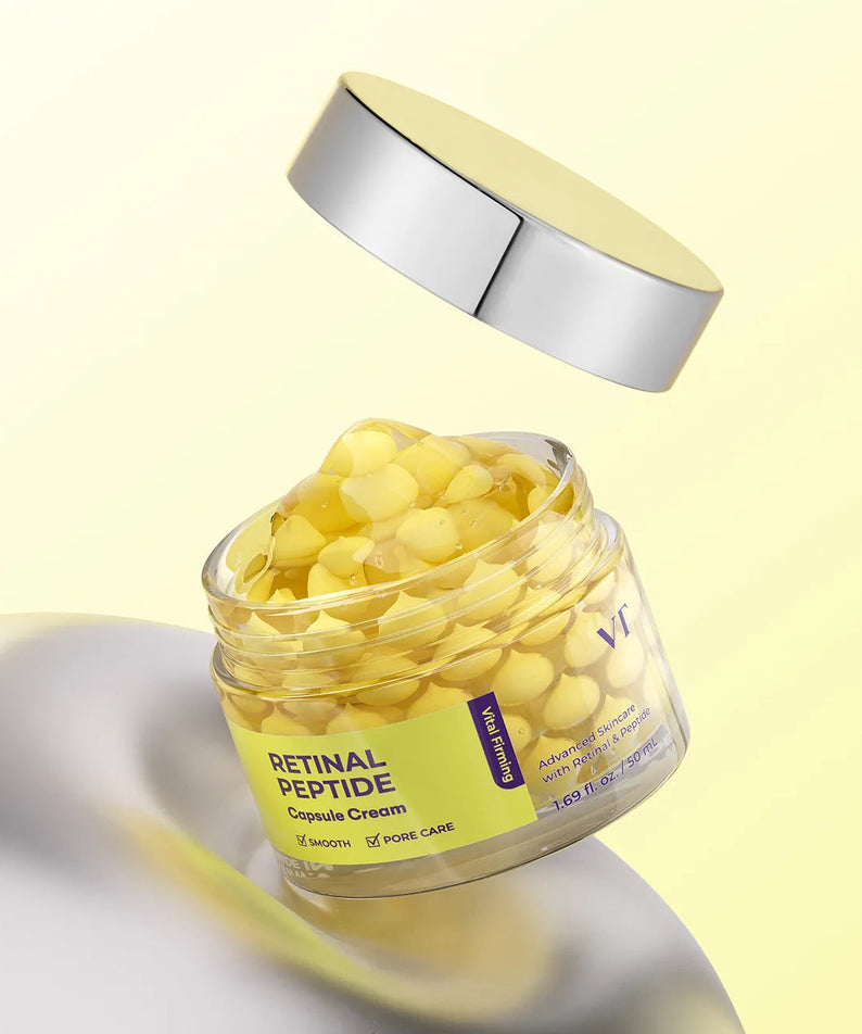 VT COSMETIC Retinal Peptide Capsule Cream 50ml, pot en verre et capsules sur fond jaune, marque VT Cosmetic.