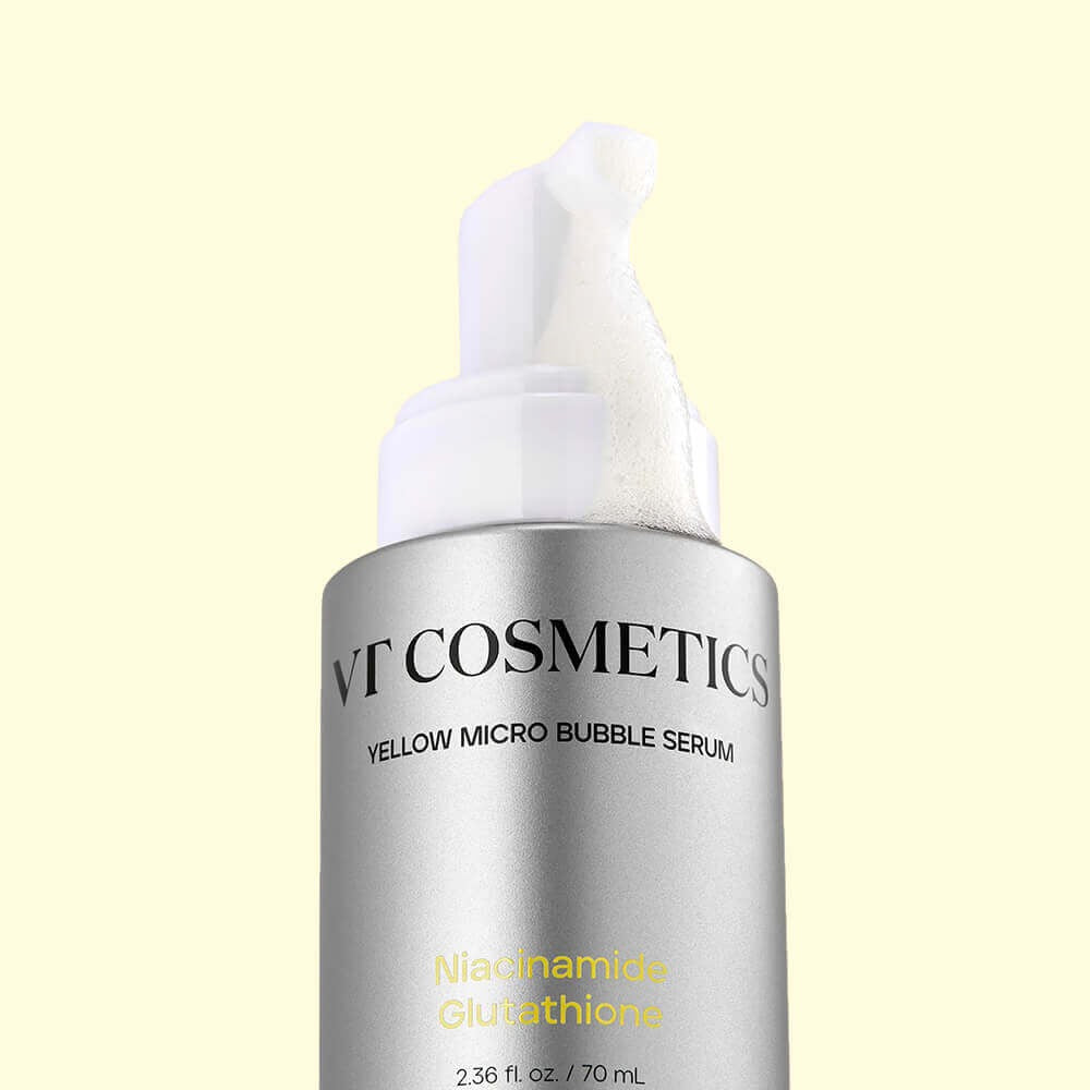 Décris l'image en français : VT COSMETICS Niacinamide Glutathione Yellow Microbubble Serum 70ml, bouteille sur fond clair.