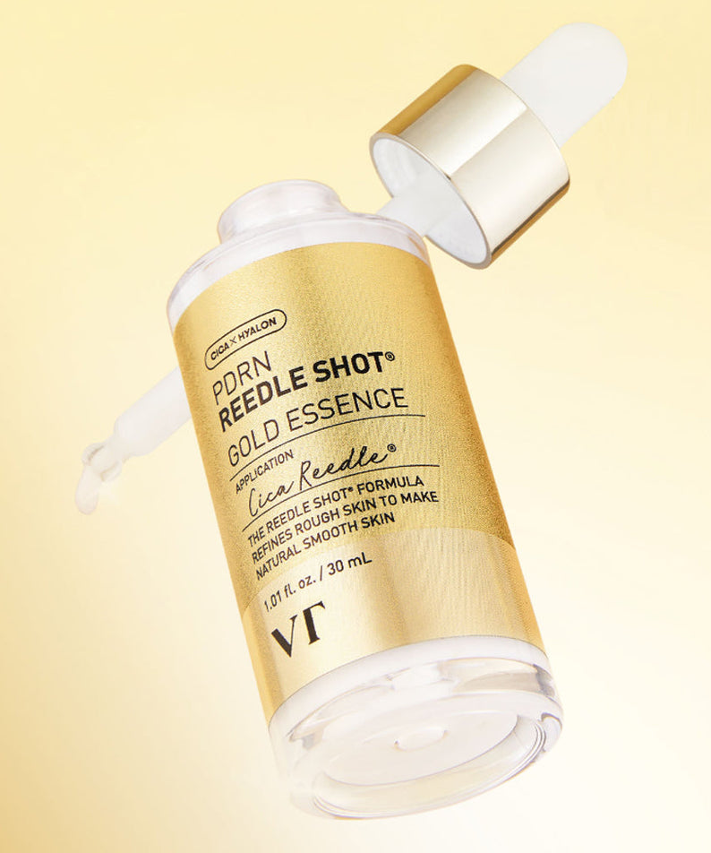 VT COSMETICS  PDRN Riddle Shot Gold Essence 30ml de VT, flacon doré sur fond beige, contexte beauté skincare