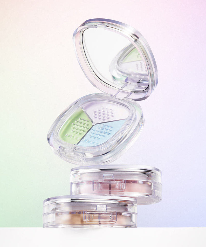 WAKE MAKE Stay Fixer Multi Color Powder 4g avec poudre multicolore en arrière-plan lumineux.