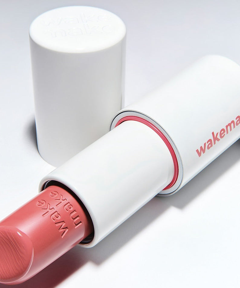 Bâton de baume WAKEMAKE Healthy Glow Balm Sticks pour une lueur naturelle, présenté en tube blanc avec capuchon ouvert.
